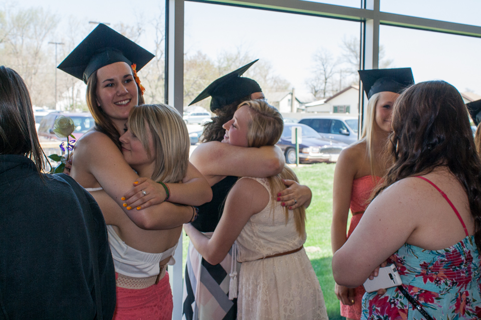 Hugging friends at graduation